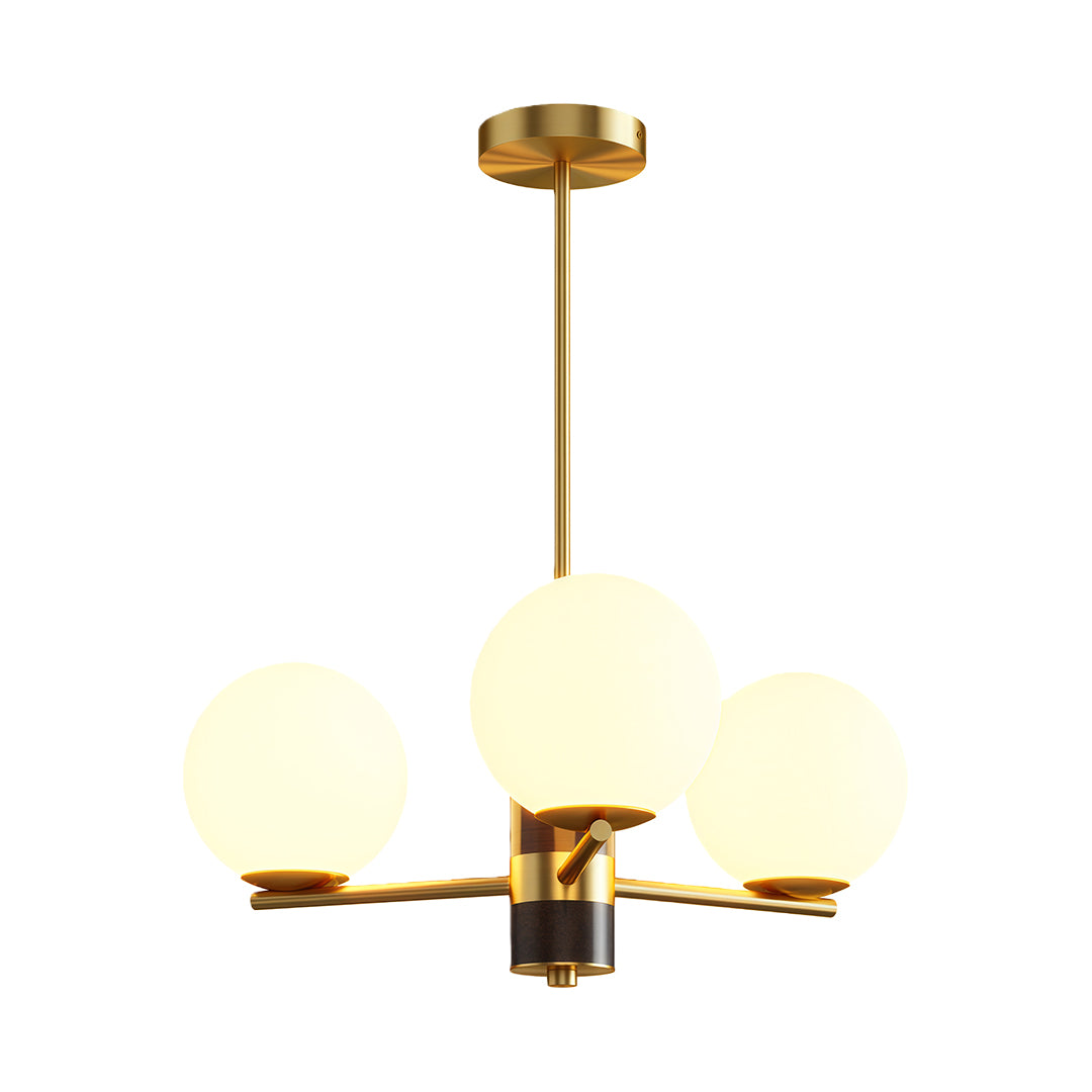 Modern luxury chandeliers with brushed brass arms and frosted white globe shades