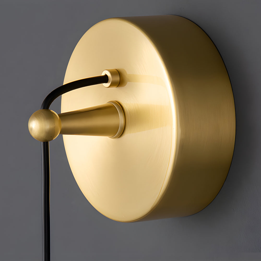 Detailed close-up of the brushed gold canopy mount for a Gold Capsule Pendant Light fixture.