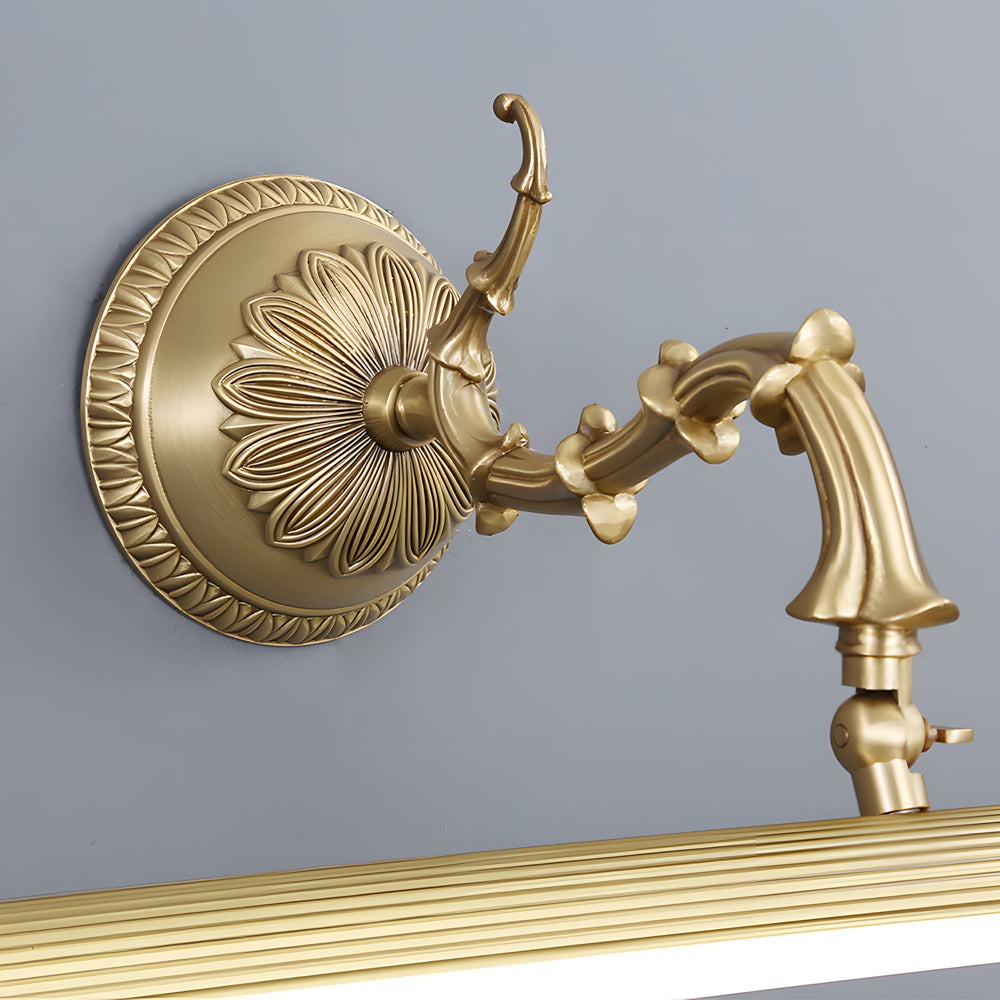 Brushed gold vanity light bar showing adjustable arm rotation