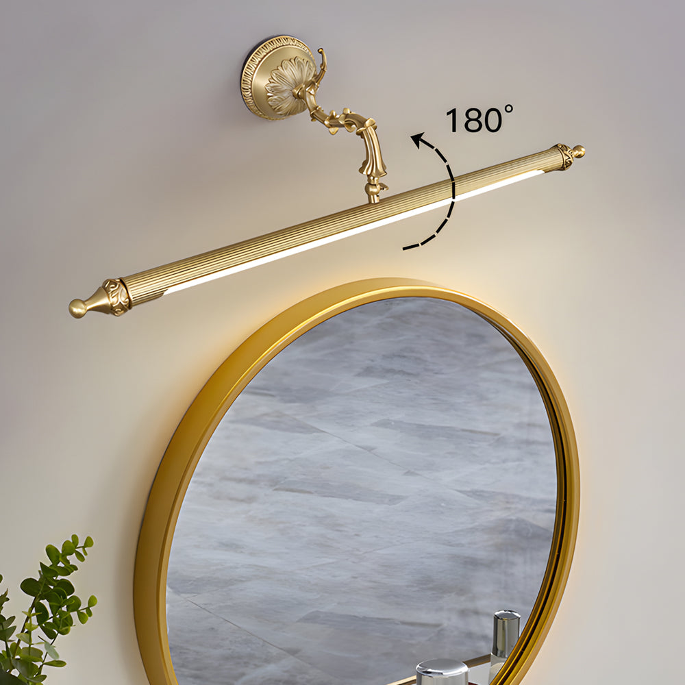 Brushed gold vanity light bar above a frosted bathroom mirror