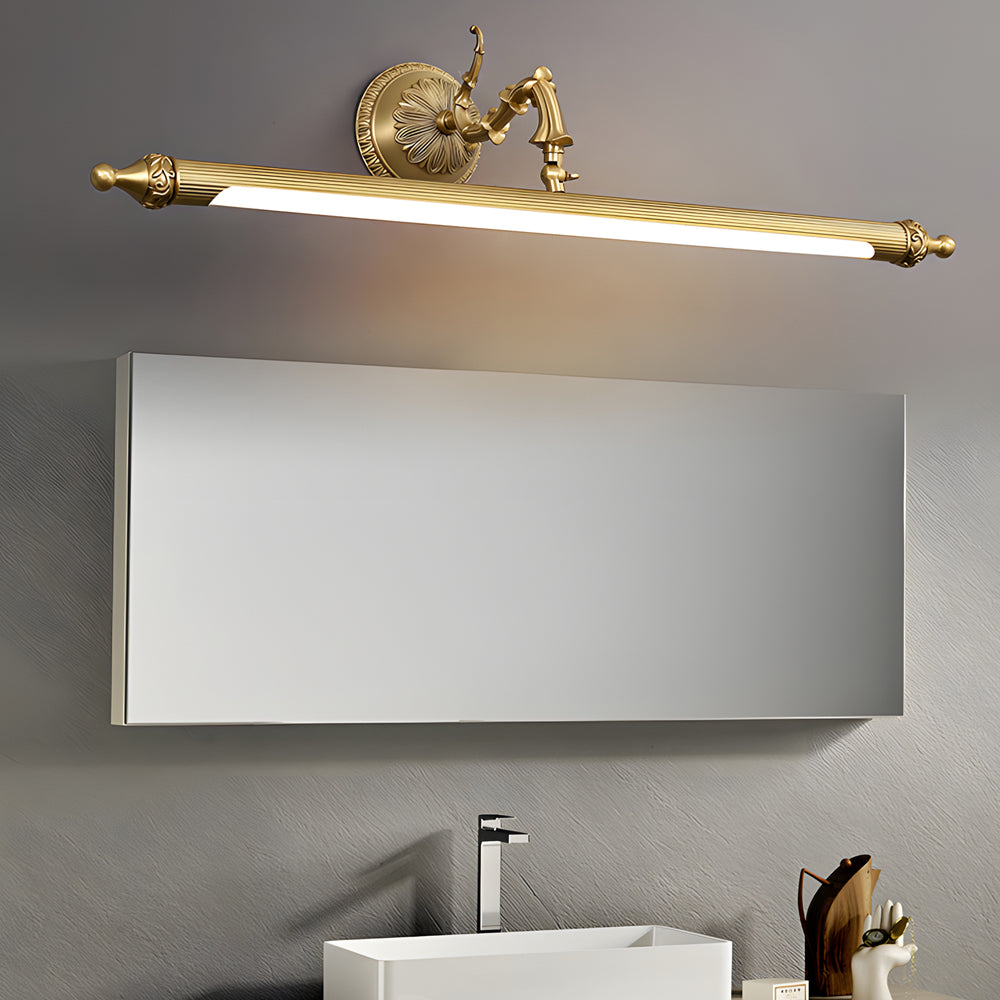 Brushed gold vanity light bar in a modern minimalist bathroom