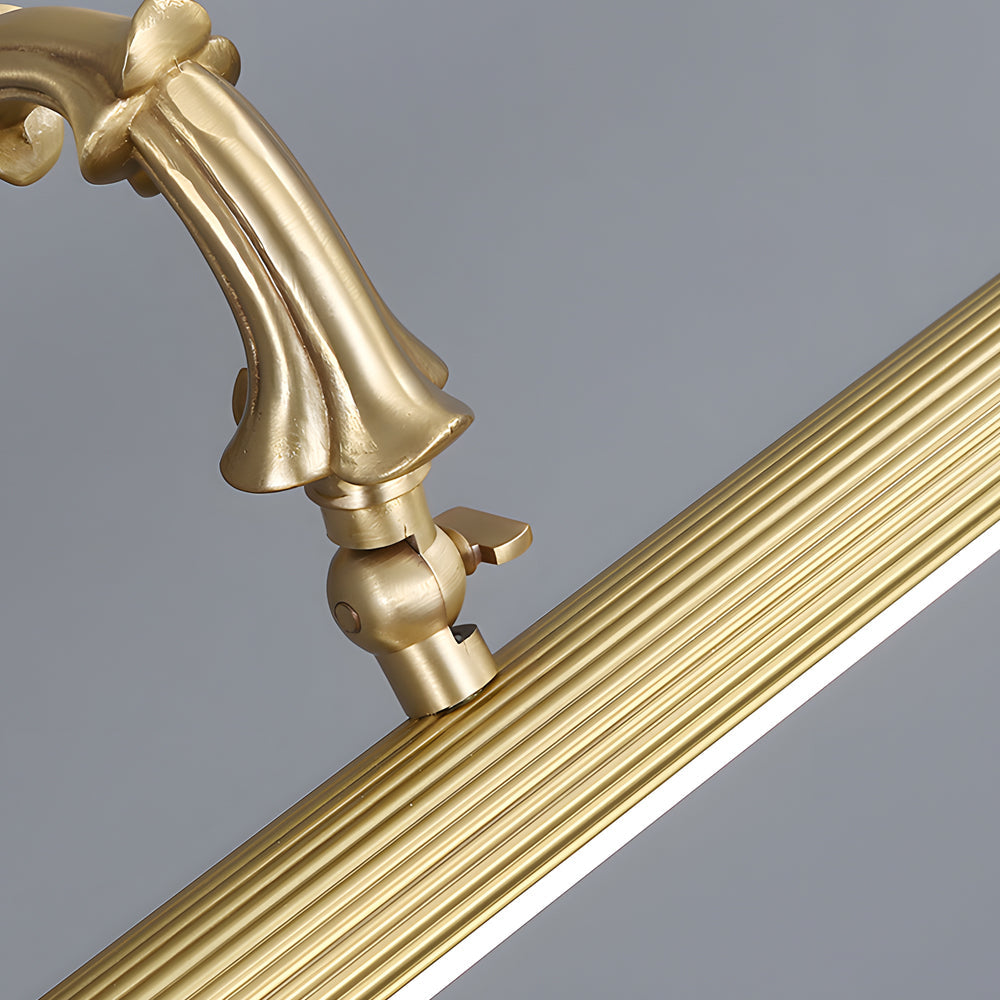 Close-up of brushed gold vanity light bar wall mount detail