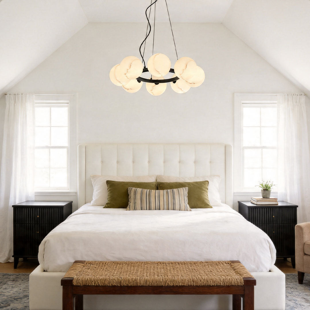 Contemporary bubble glass chandelier installed in a cozy attic bedroom with soft ambient lighting.