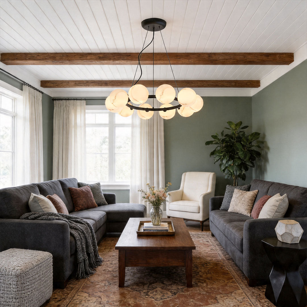 Modern bubble chandelier with glass globes illuminating a stylish living room with warm tones.