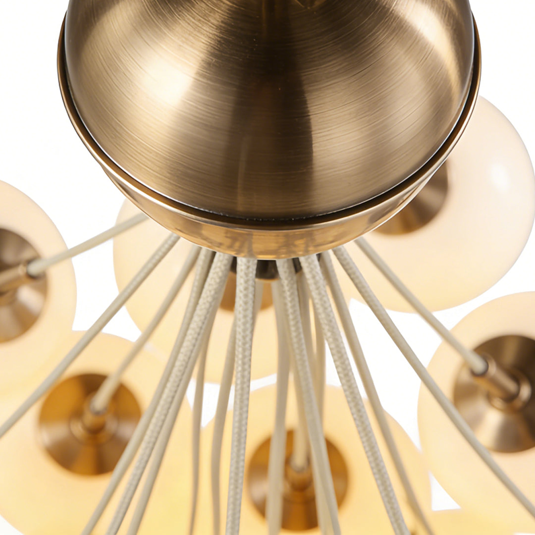 Top view of a bubble glass chandelier with a polished metal canopy and sleek, radiating glass bubble arms.