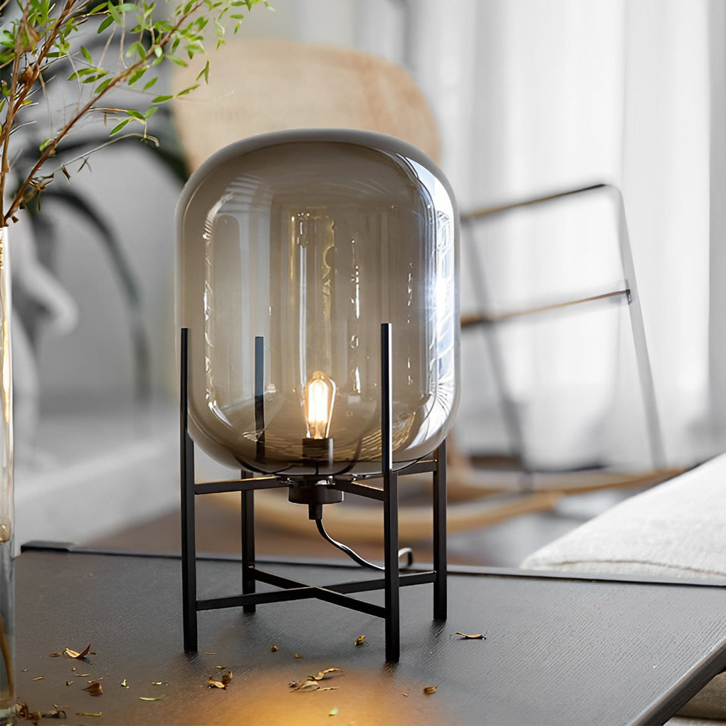 Bubble glass floor lamp with a clear glass shade, casting a soft glow in a modern interior.