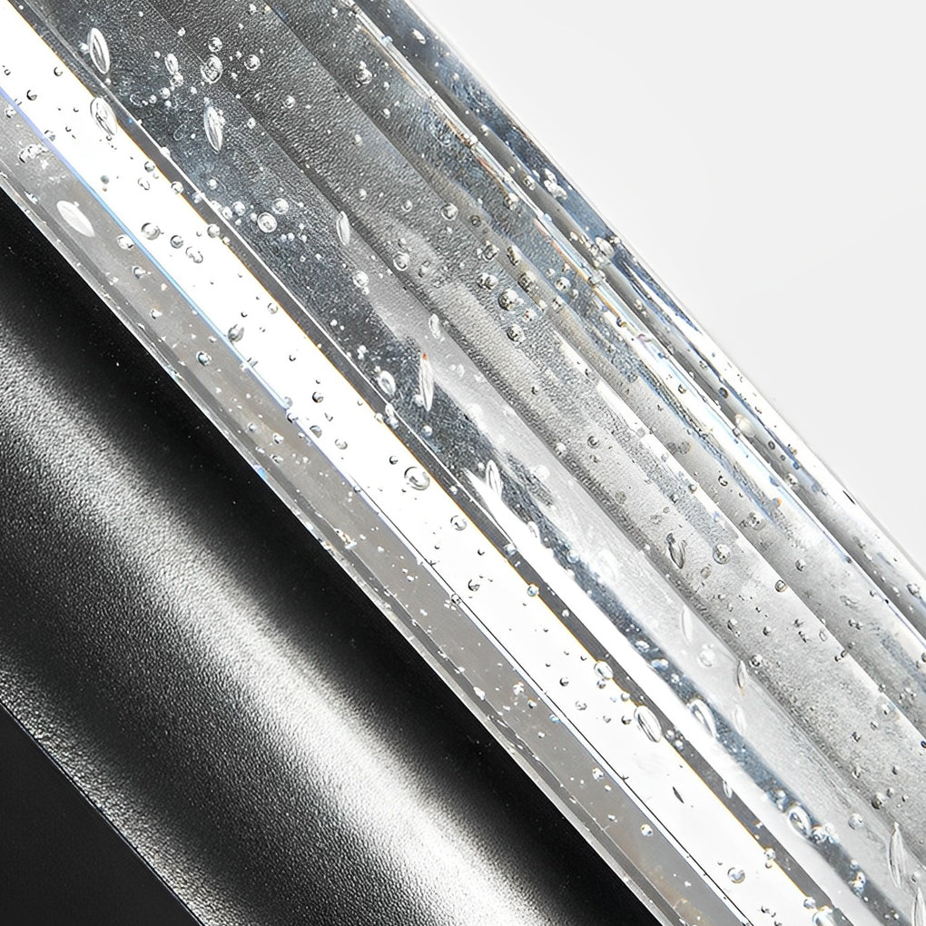 Detailed view of bubble wall sconce glass filled with air bubbles, creating sparkling light reflections.