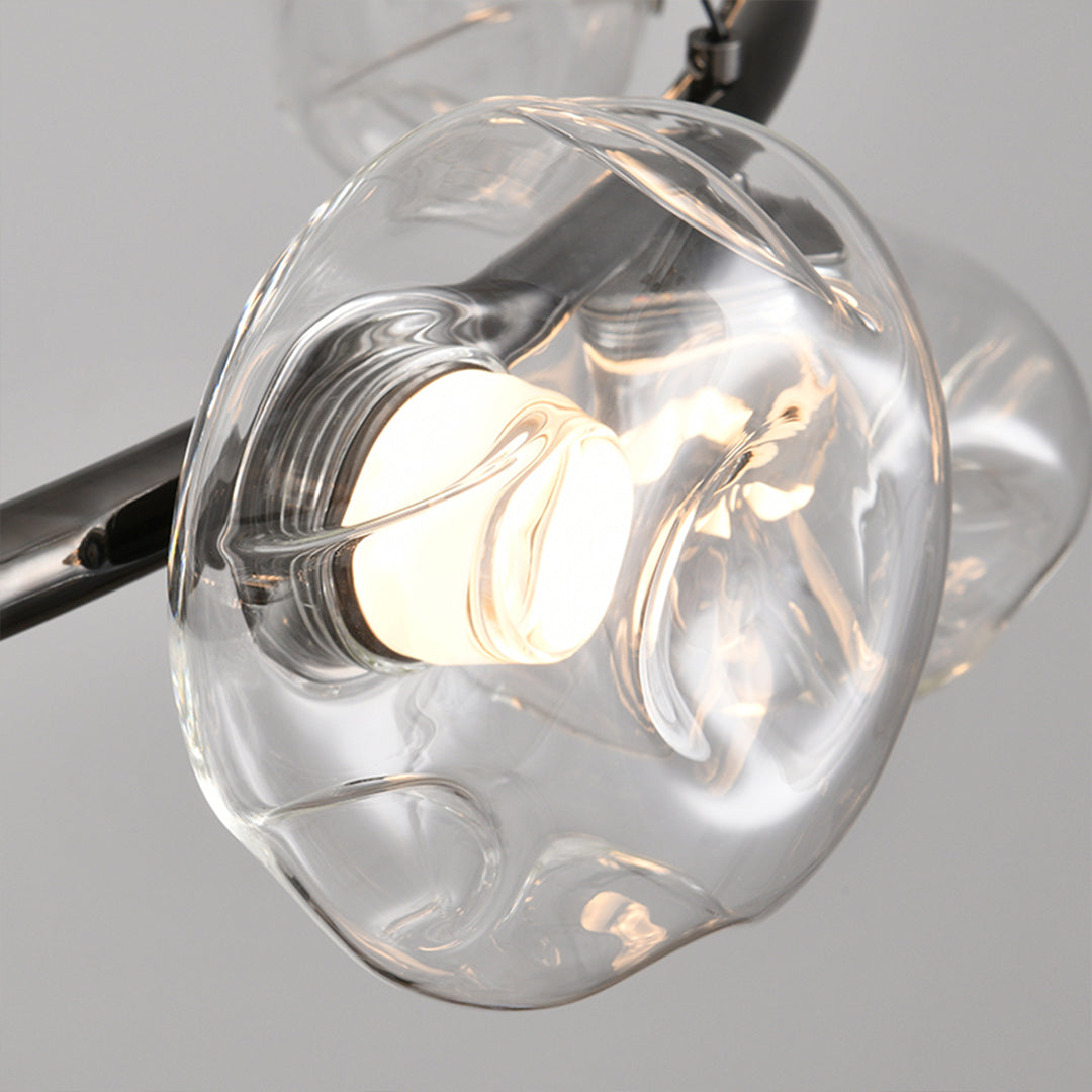 Bubbles chandelier with clear glass spheres providing elegant overhead lighting in neutral interior