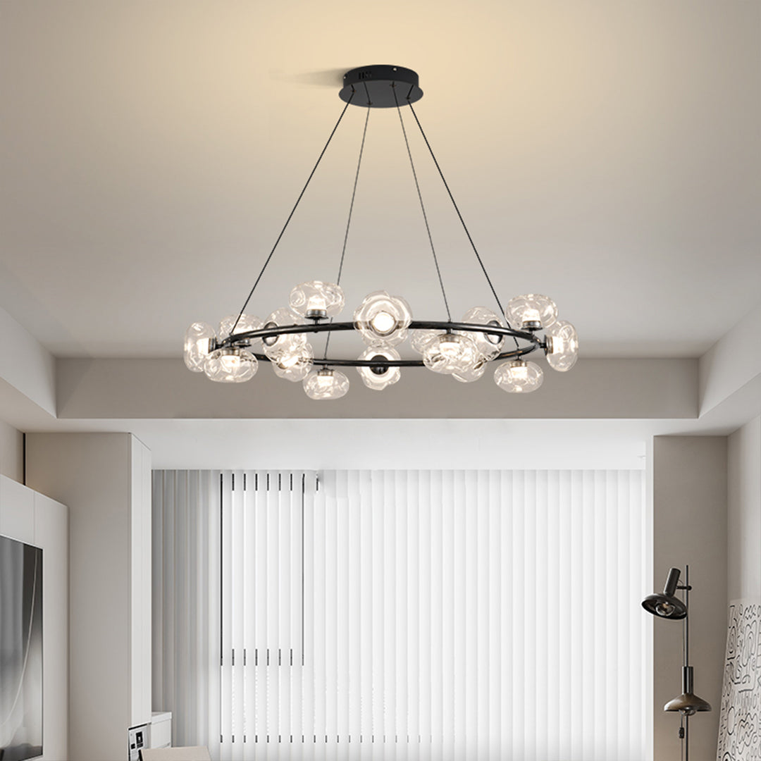 Bubbles chandelier installation in modern kitchen area with warm glass orb illumination