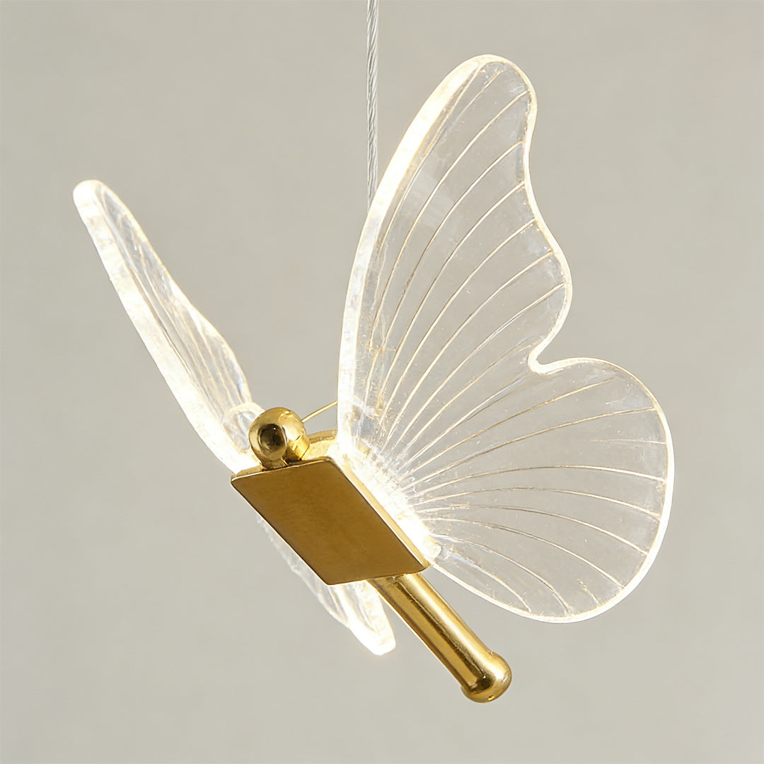 Minimalist butterfly chandelier shown against a clean white background.
