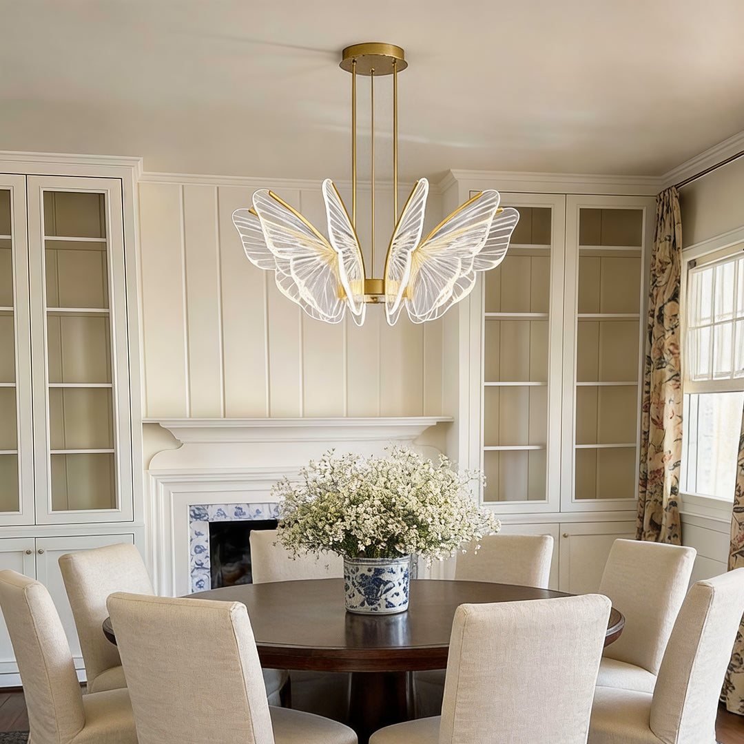 Butterfly pendant light providing soft illumination above a cozy bedroom.