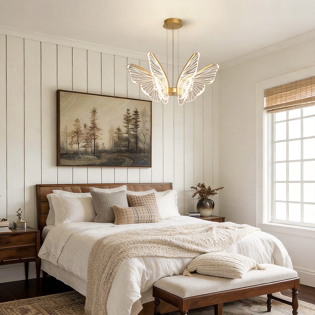 Butterfly pendant light providing soft illumination above a cozy bedroom.