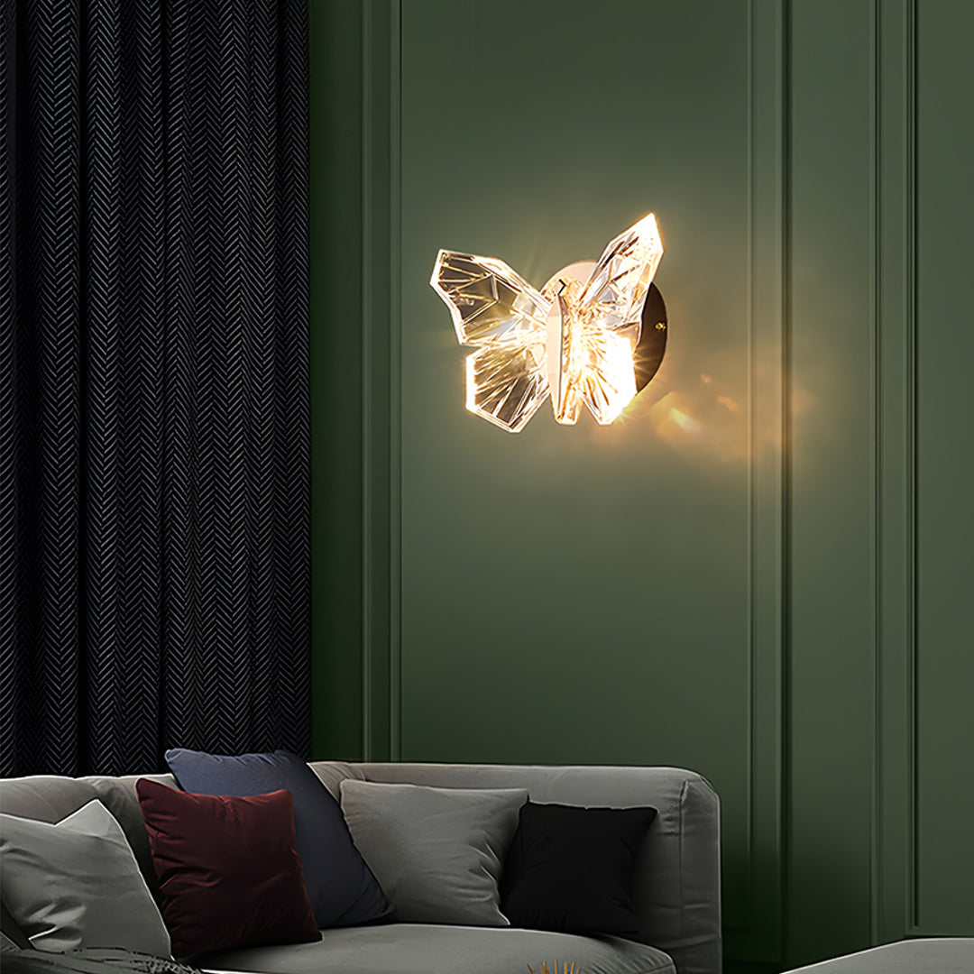 Illuminated butterfly wall light creating ambient glow in modern green bedroom interior setting