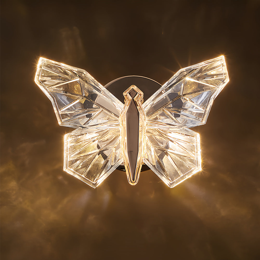 Butterfly wall light glowing with warm golden radiance showcasing detailed wing crystalline structure