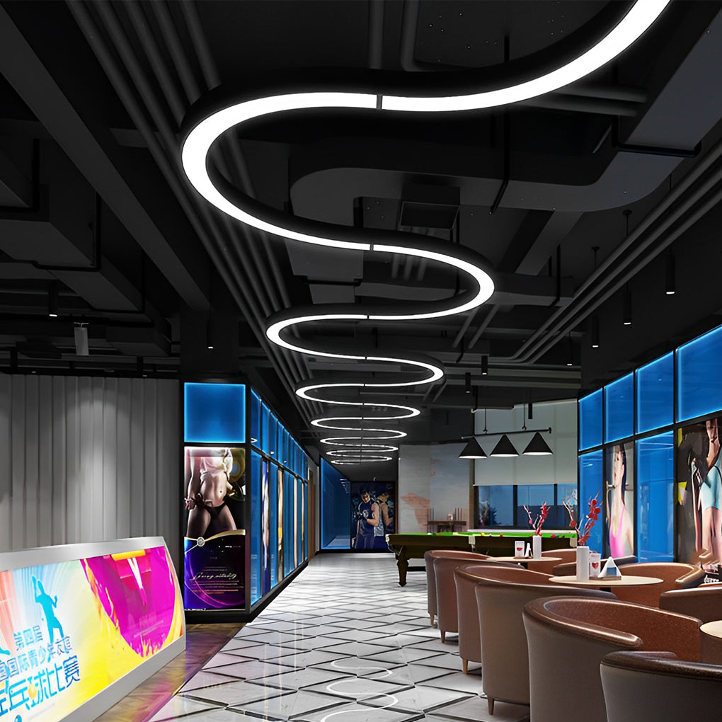 C shape pendant light installed in modern commercial corridor with continuous circular LED ceiling design.