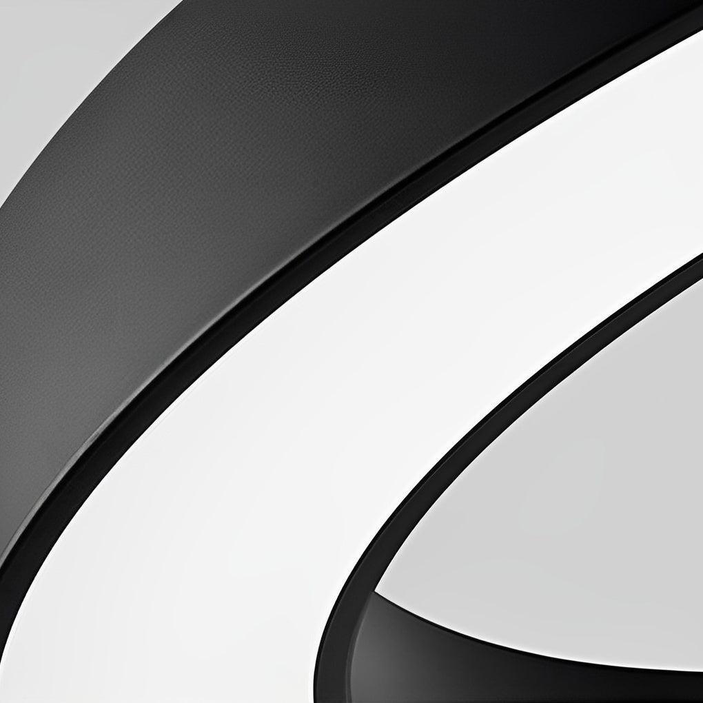 Close-up detail of C shape pendant light aluminum frame and LED diffuser.