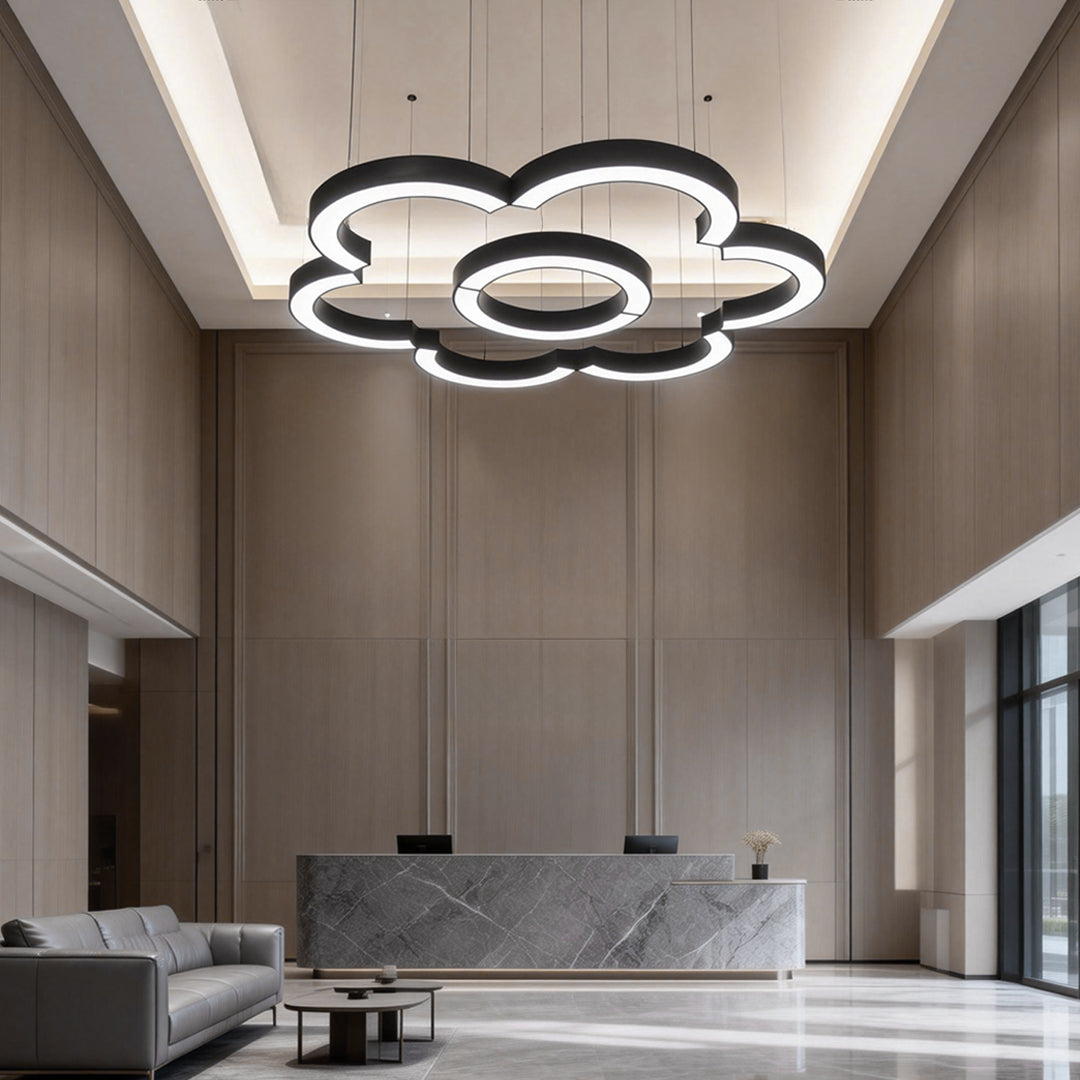 Modern C shape pendant light fixture used in hotel lobby ceiling with minimalist architectural style.