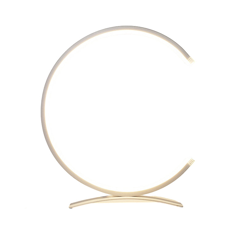 C shaped table lamp in black, side view of the elegant design.