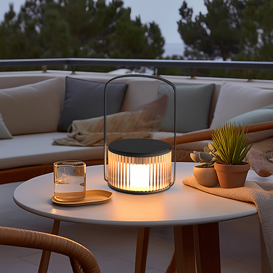 Warm-glow camping LED lanterns placed on an outdoor table for evening gatherings.