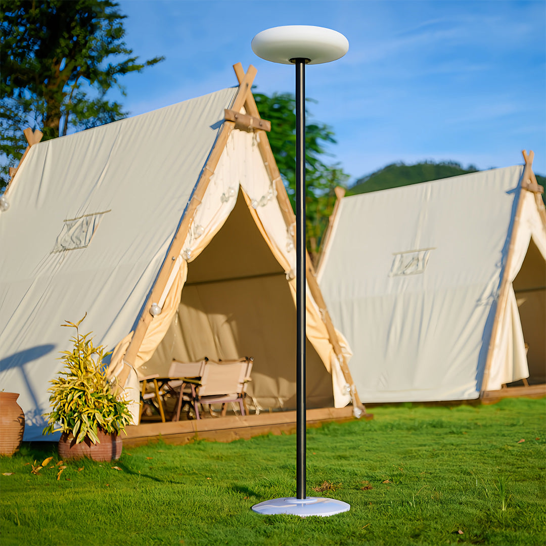 Outdoor patio floor lamp beside a tent, stylish and functional lighting for camping