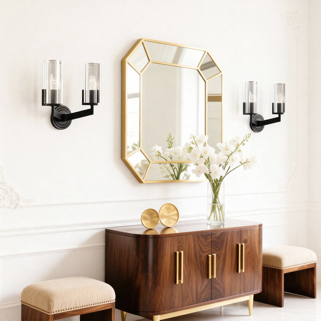Candle chandeliers creating symmetry in bright bedroom with geometric mirror and modern styling