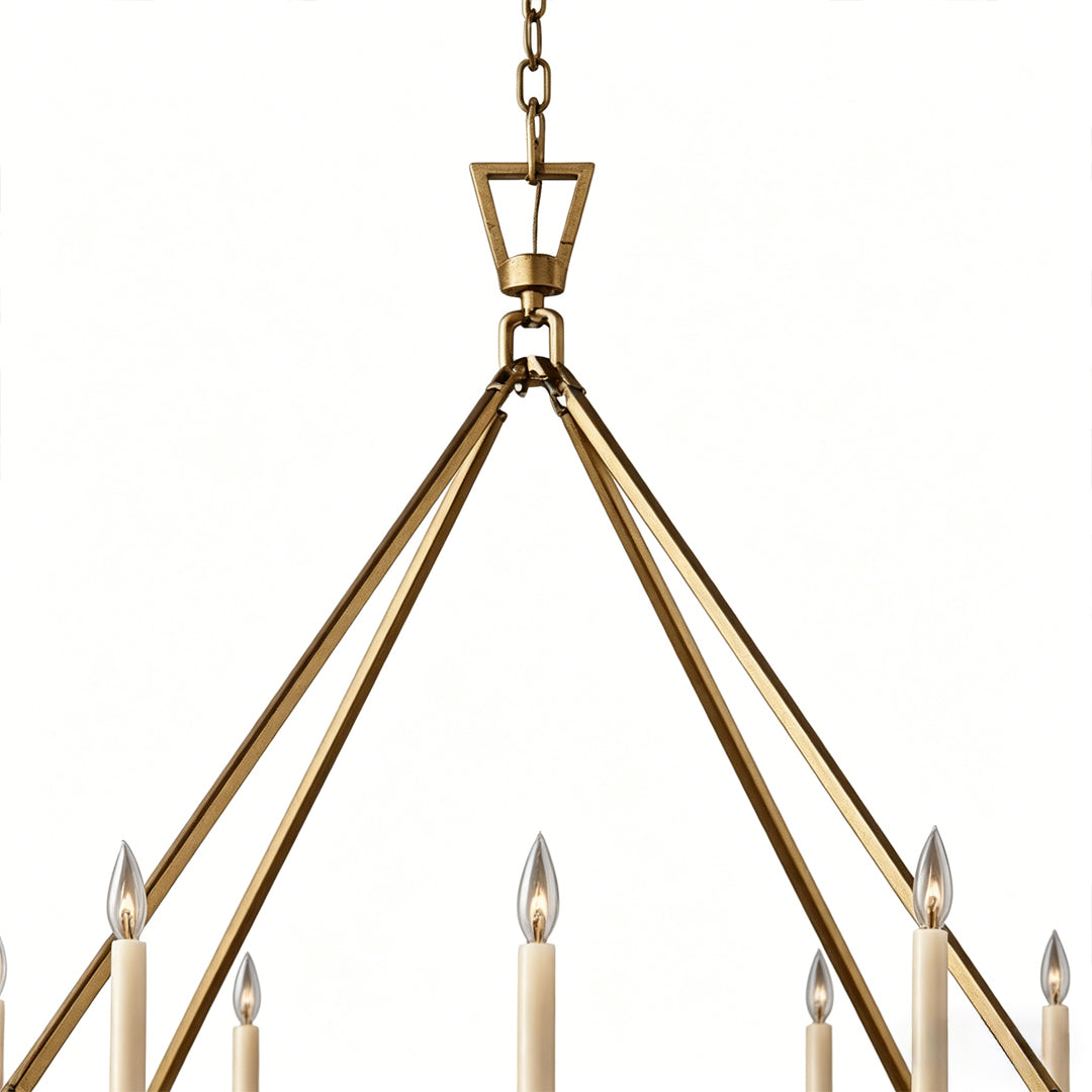 Candles chandelier detail featuring gold suspension frame and elegant candle bulb holders.
