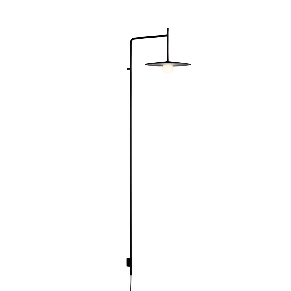 Tall cantilever wall lamp with vertical arm and compact shade, presented as a full-height lighting solution.