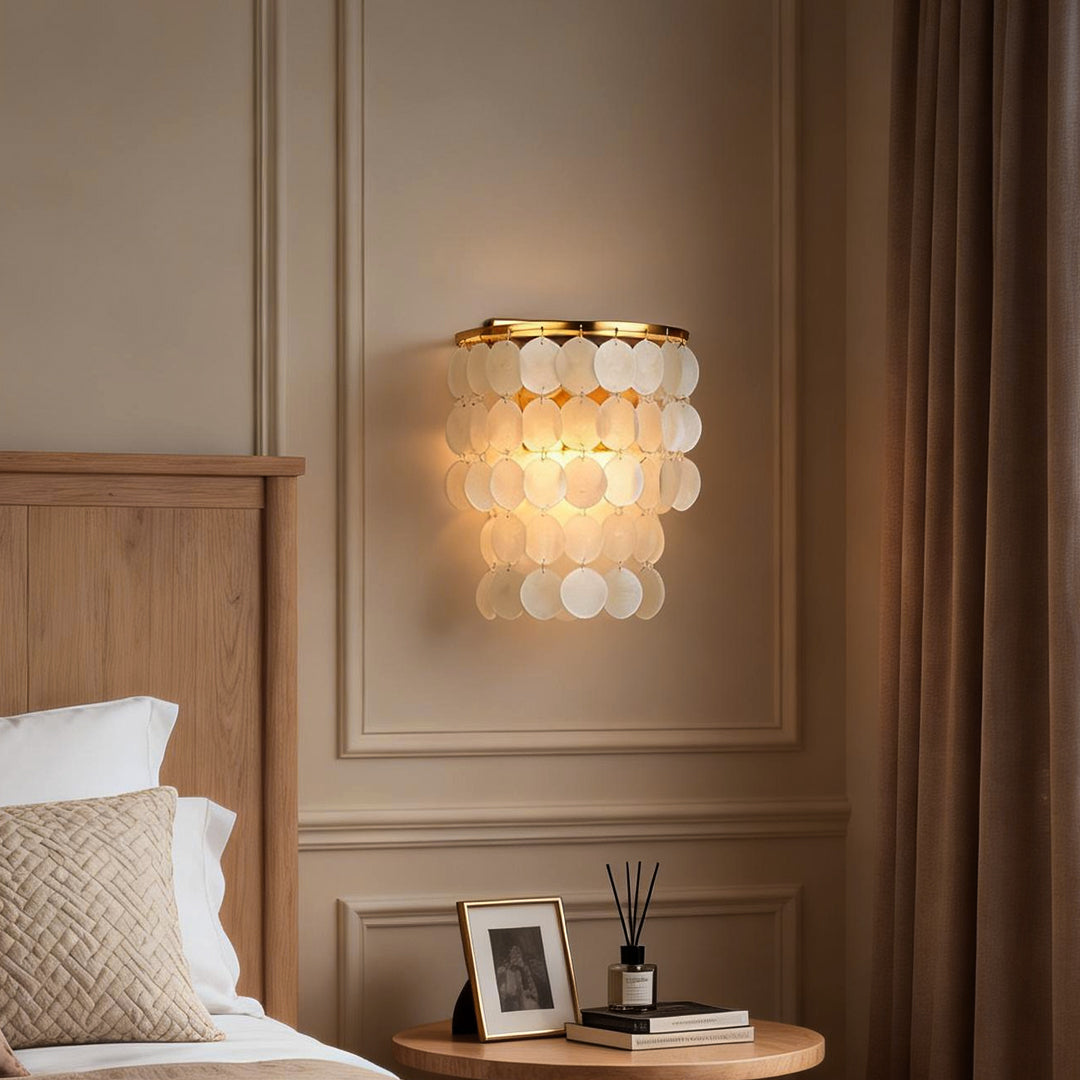 Elegant capiz shell wall sconce with soft lighting, creating a serene ambiance for any modern living space.