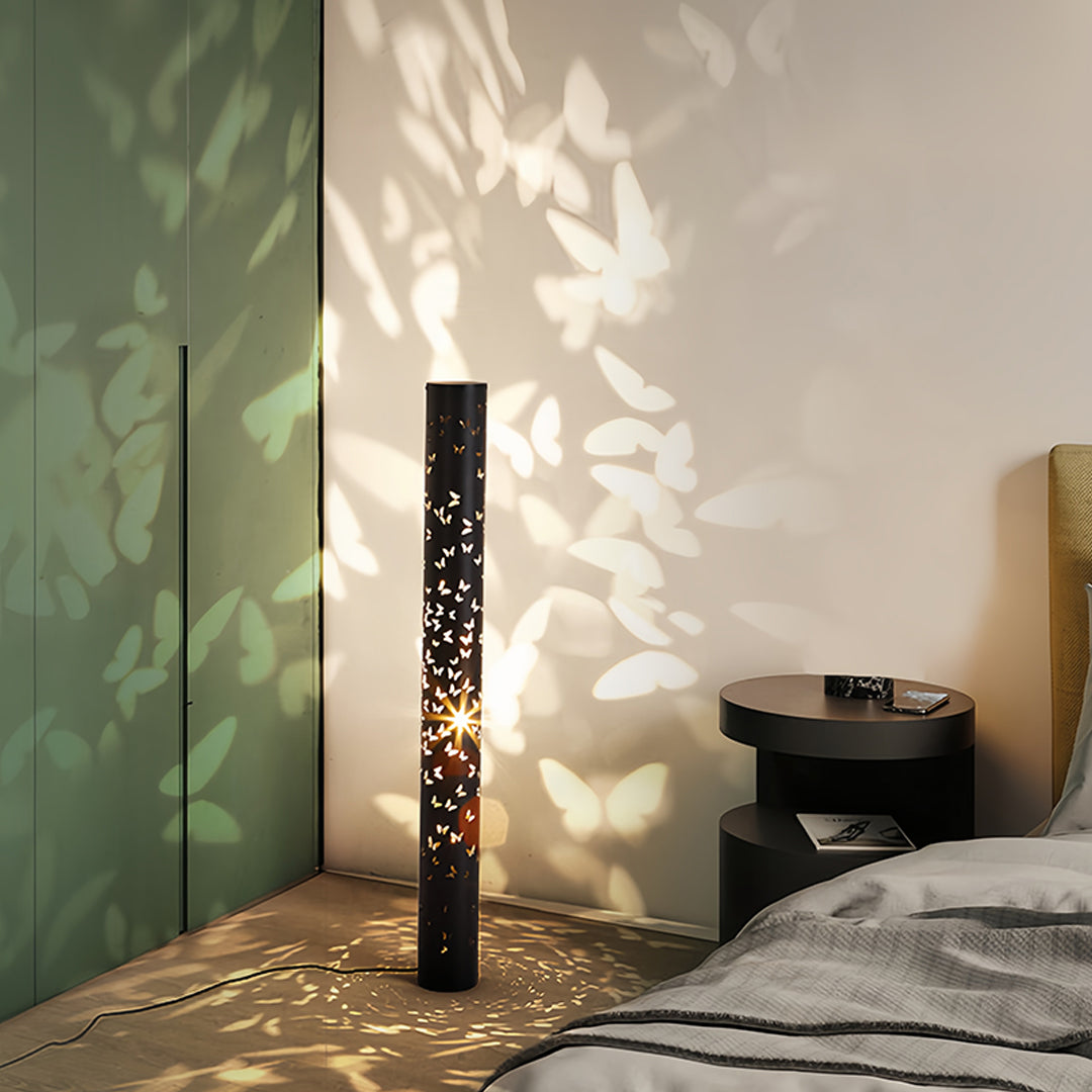 Modern interior featuring small black pendant light with captivating butterfly shadow display