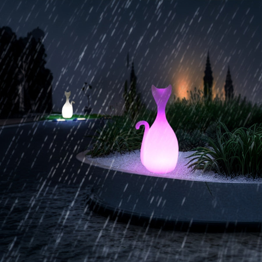 Blue and pink cat lights glowing in rain creating magical waterproof outdoor lighting display