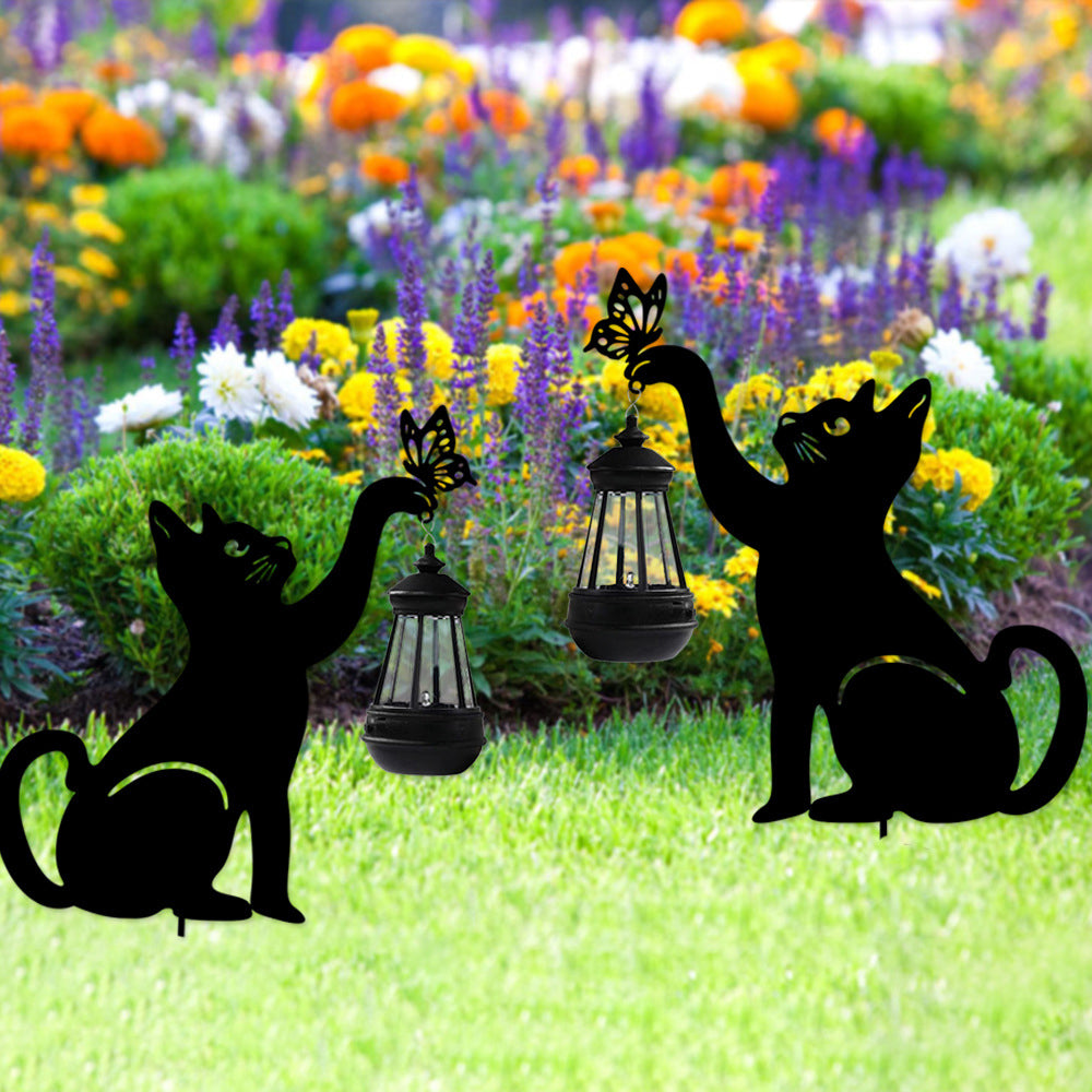 Cat silhouette light enhancing a garden with magical, ambient glow.