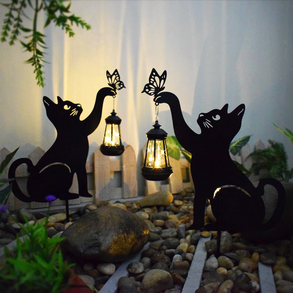 Cat silhouette light enhancing a garden with playful, ambient glow.