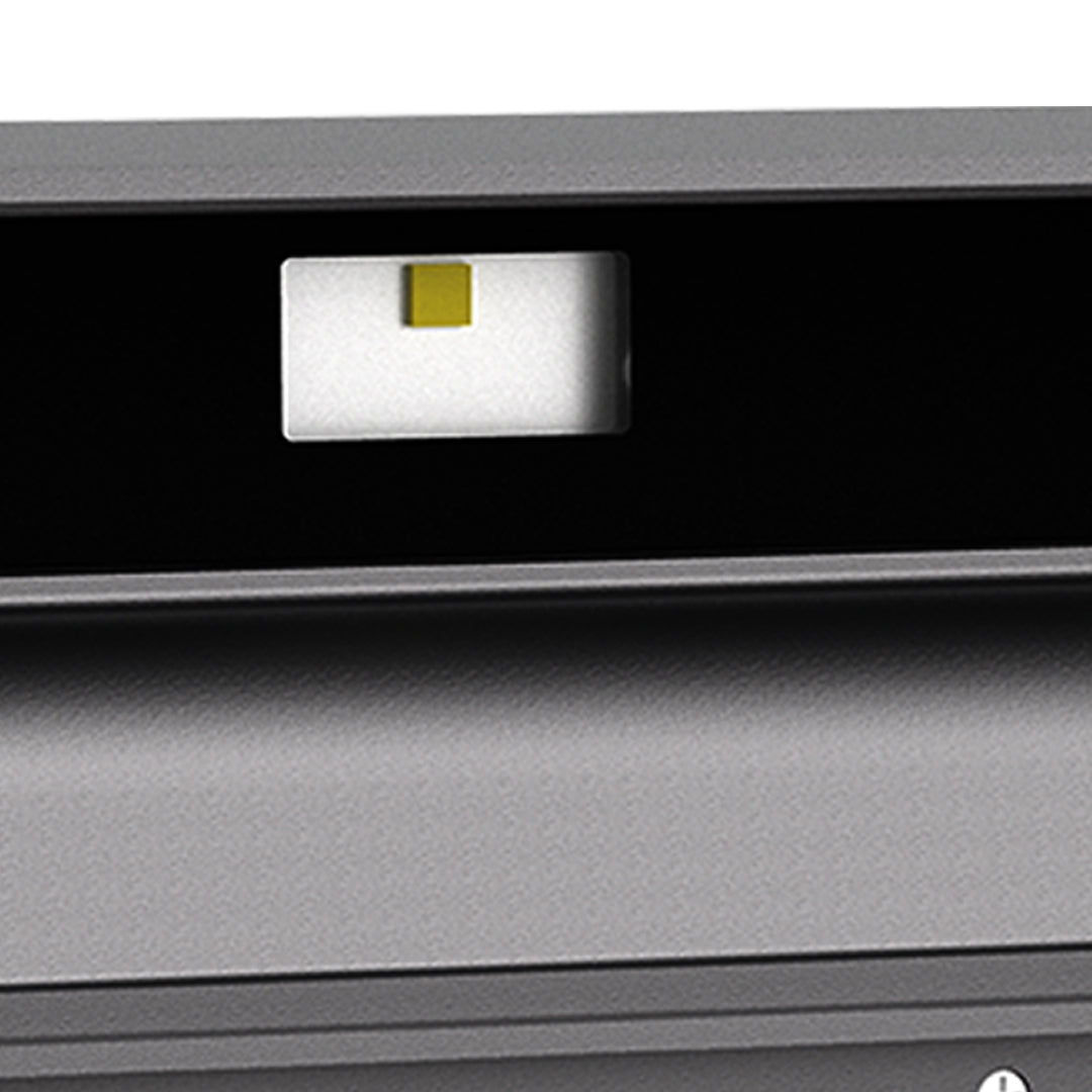 Contemporary wall-mounted LED fixture with angular black housing and directional beam