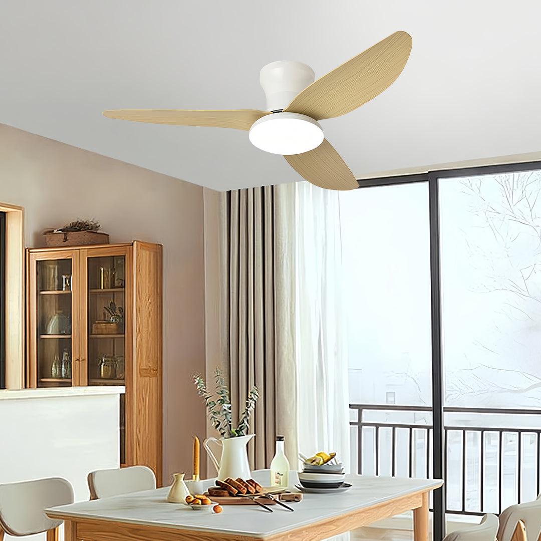 Ceiling fan with dimmer light in bright dining area with natural wood blades complementing modern furniture