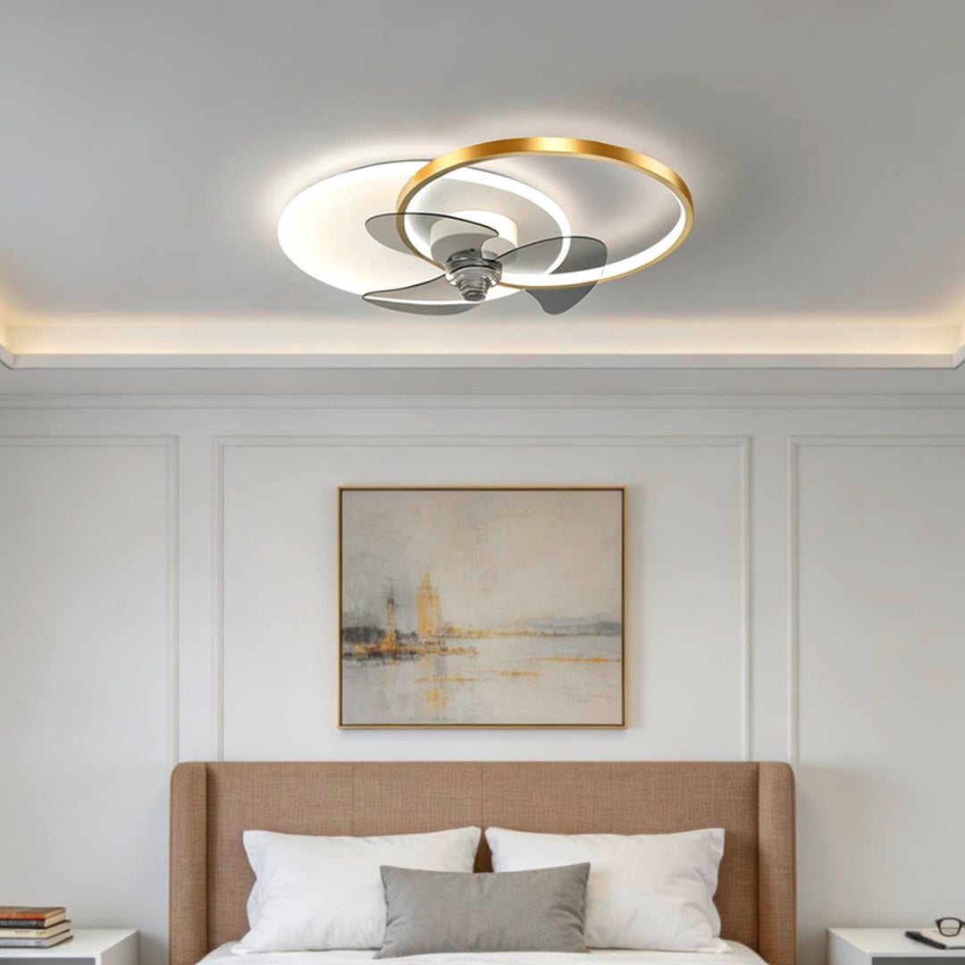 Ceiling fan with LED light and black ring detail in a modern sleeping space.