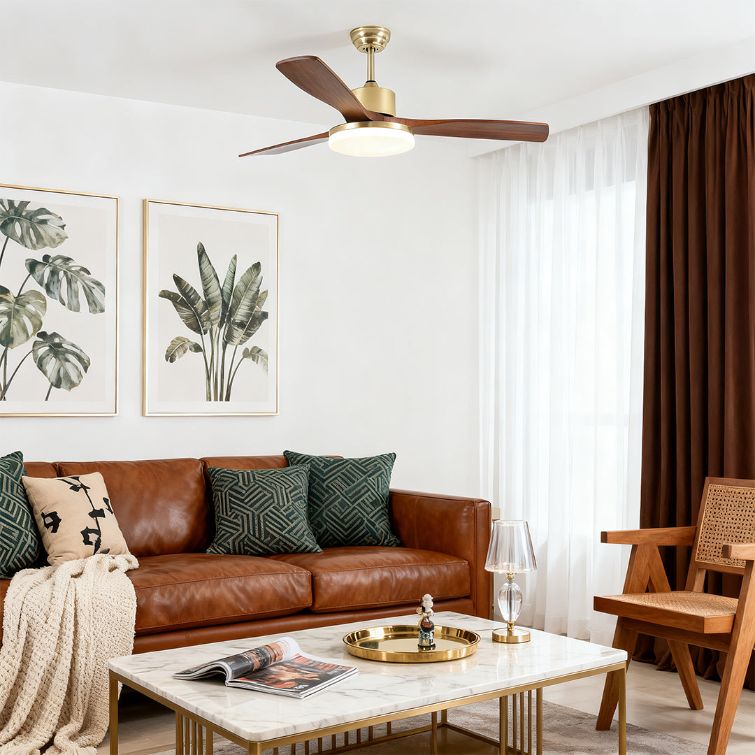 Ceiling fan with light and remote control, installed above a sofa for comfort and style in a living room.