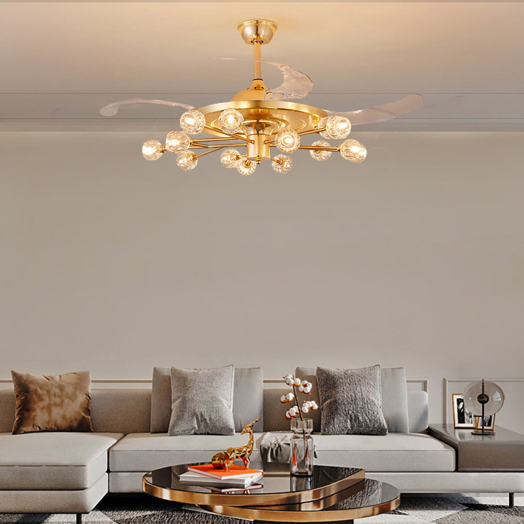 Ceiling fan with multiple lights providing warm illumination in minimalist living room with grey sofa
