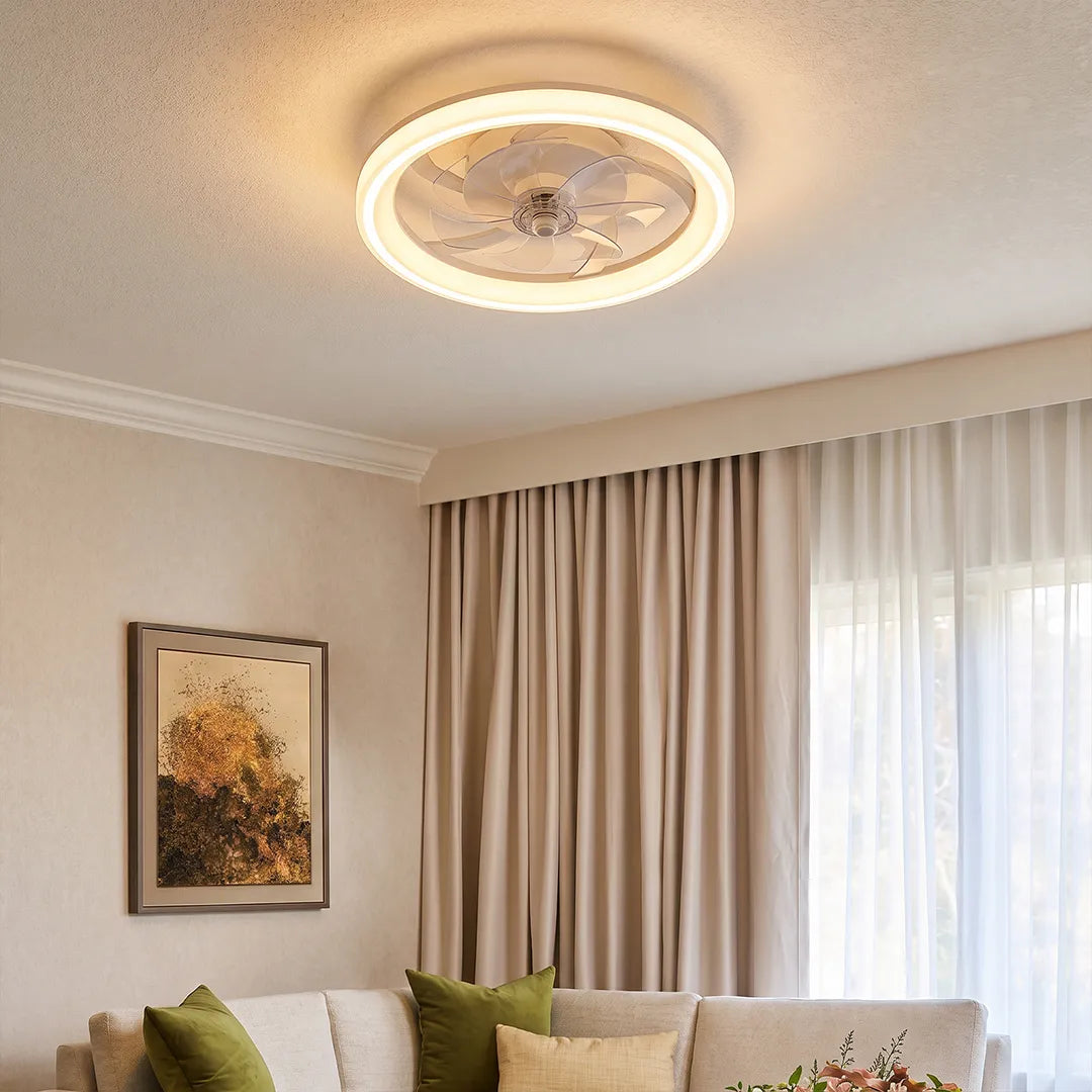 Ceiling fans with light fixtures installed in a bright living room with a circular LED ring design.