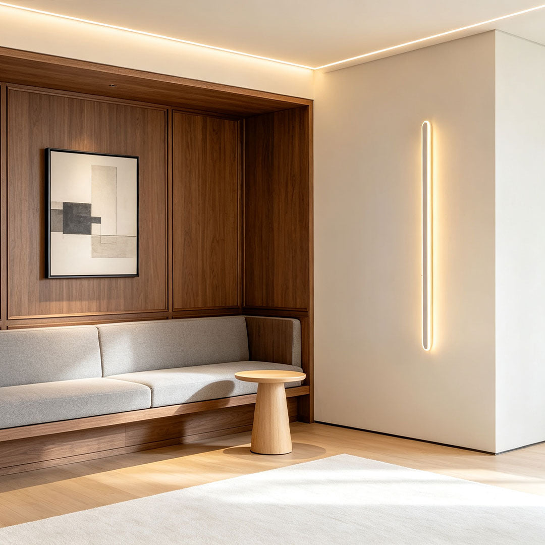 Vertical ceiling linear lights adding elegant architectural lighting to a contemporary lounge space.