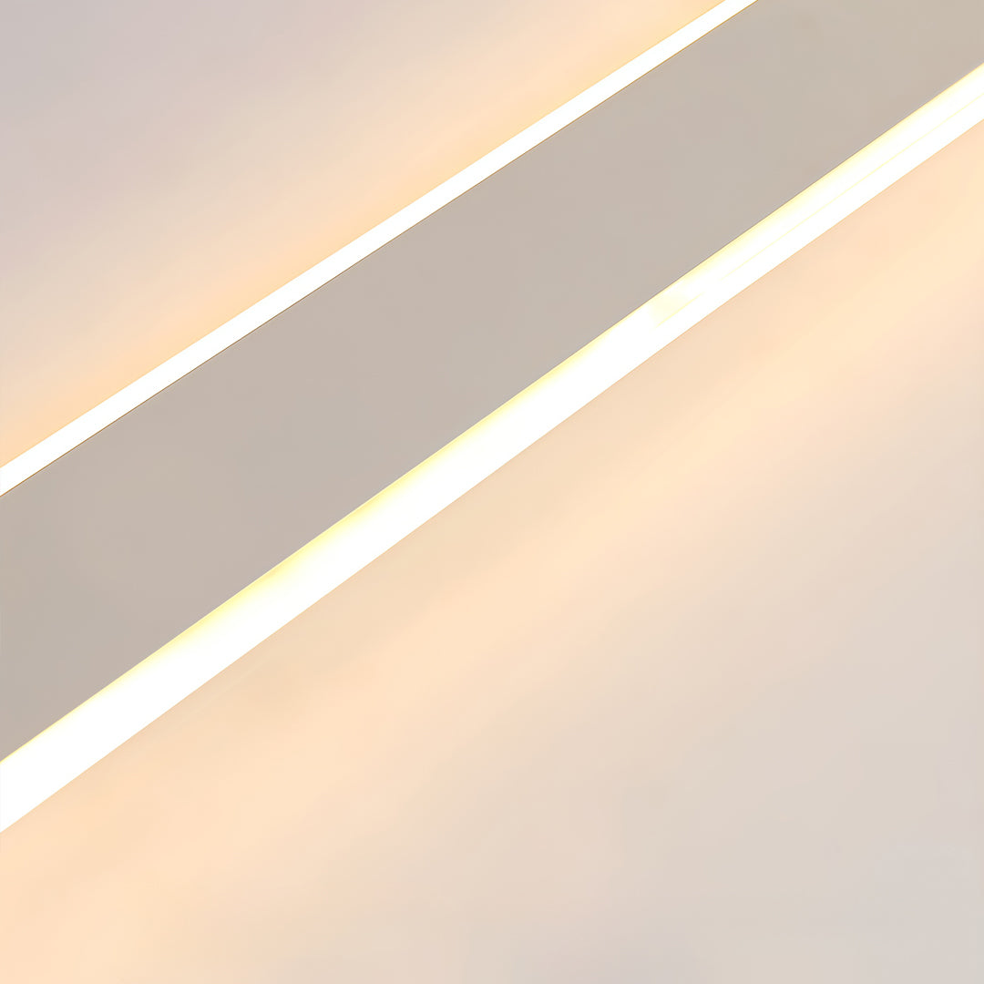Close-up detail of slim ceiling linear lights with soft integrated LED illumination.