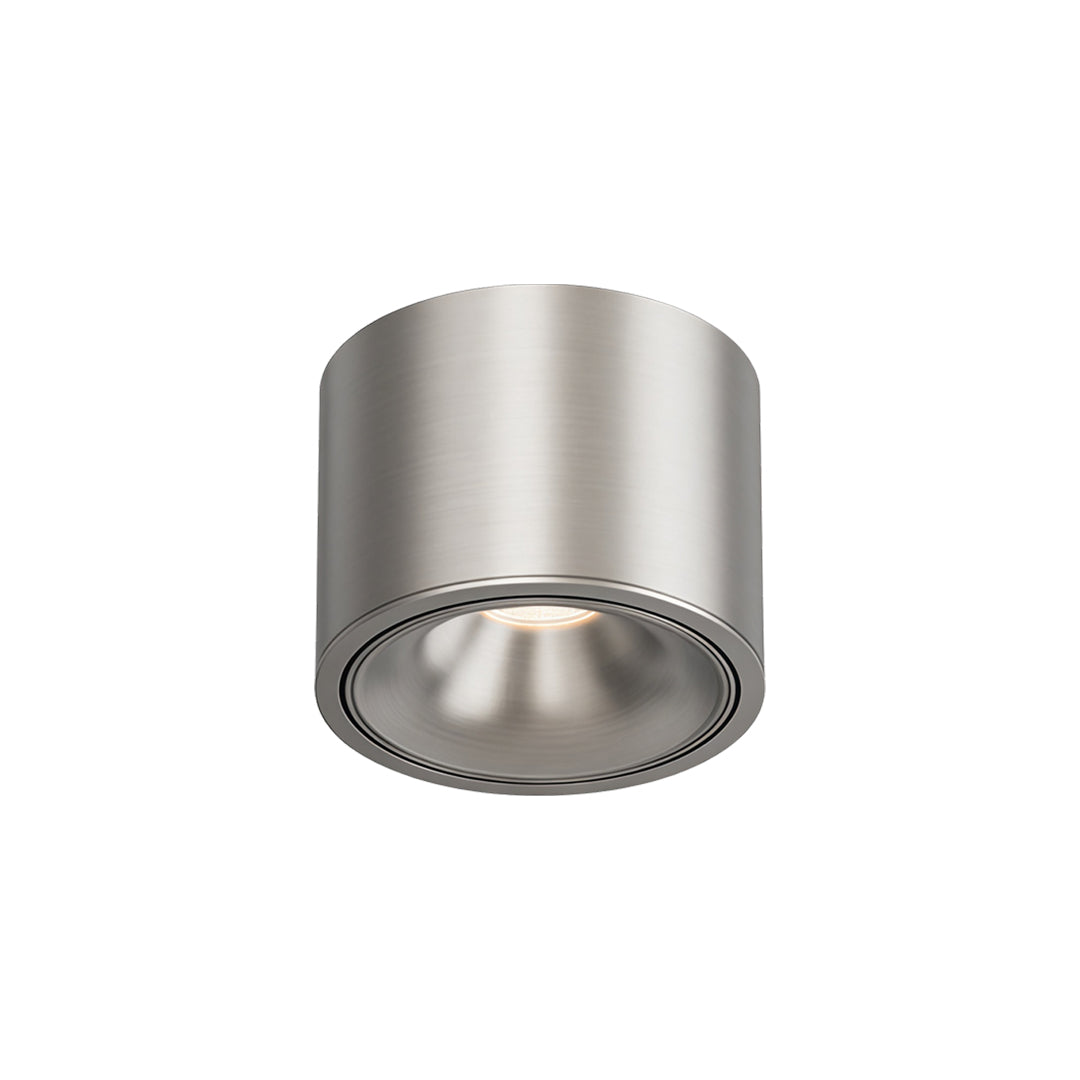 Ceiling spotlight surface-mounted fixture with compact cylindrical design for interior spaces.