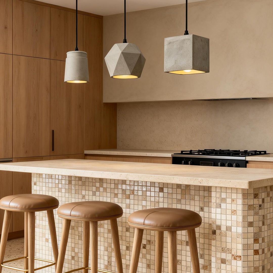 Cement look pendant lights enhancing a contemporary kitchen island with elegant directional light.