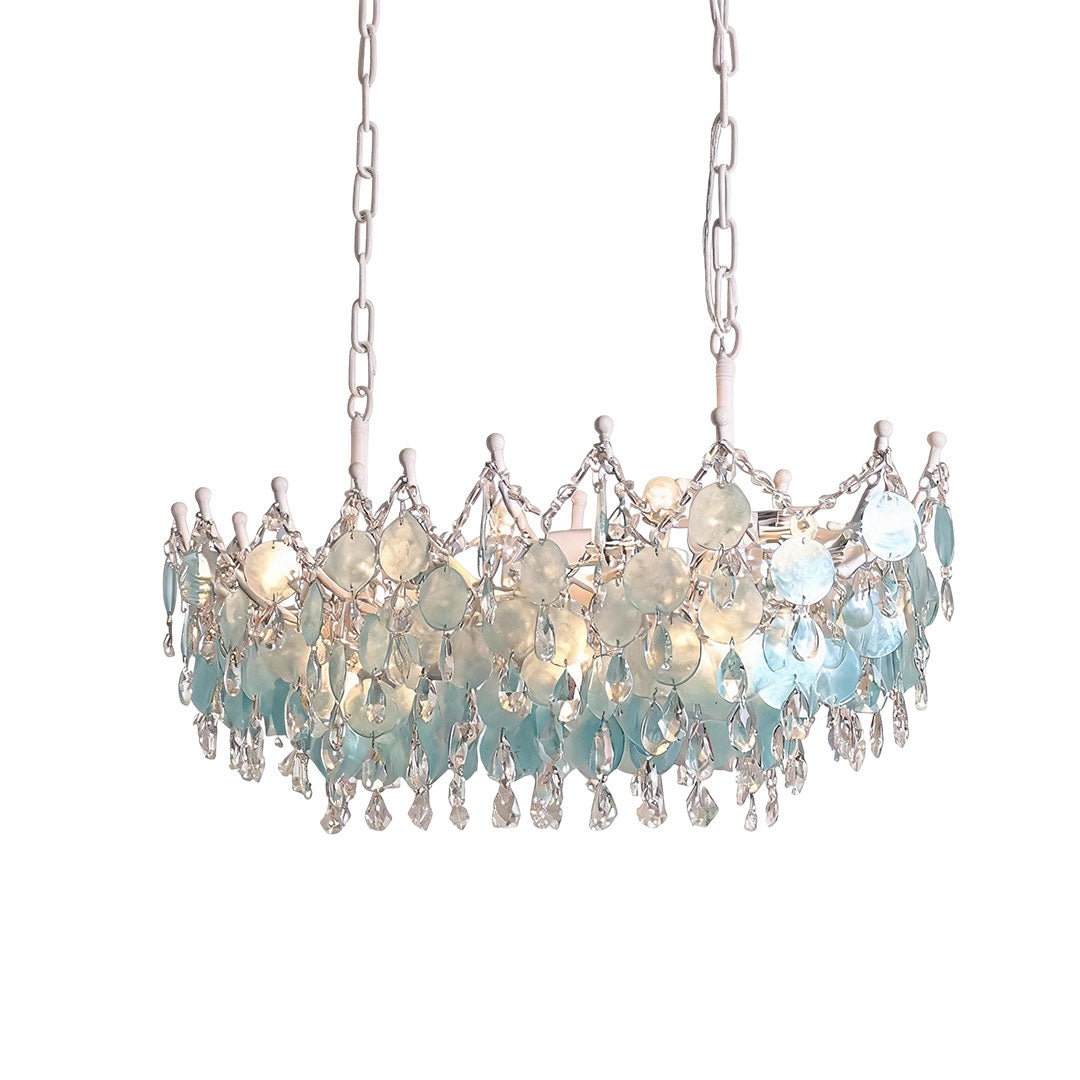 Glam chandelier with cascading blue glass discs suspended from decorative chains.