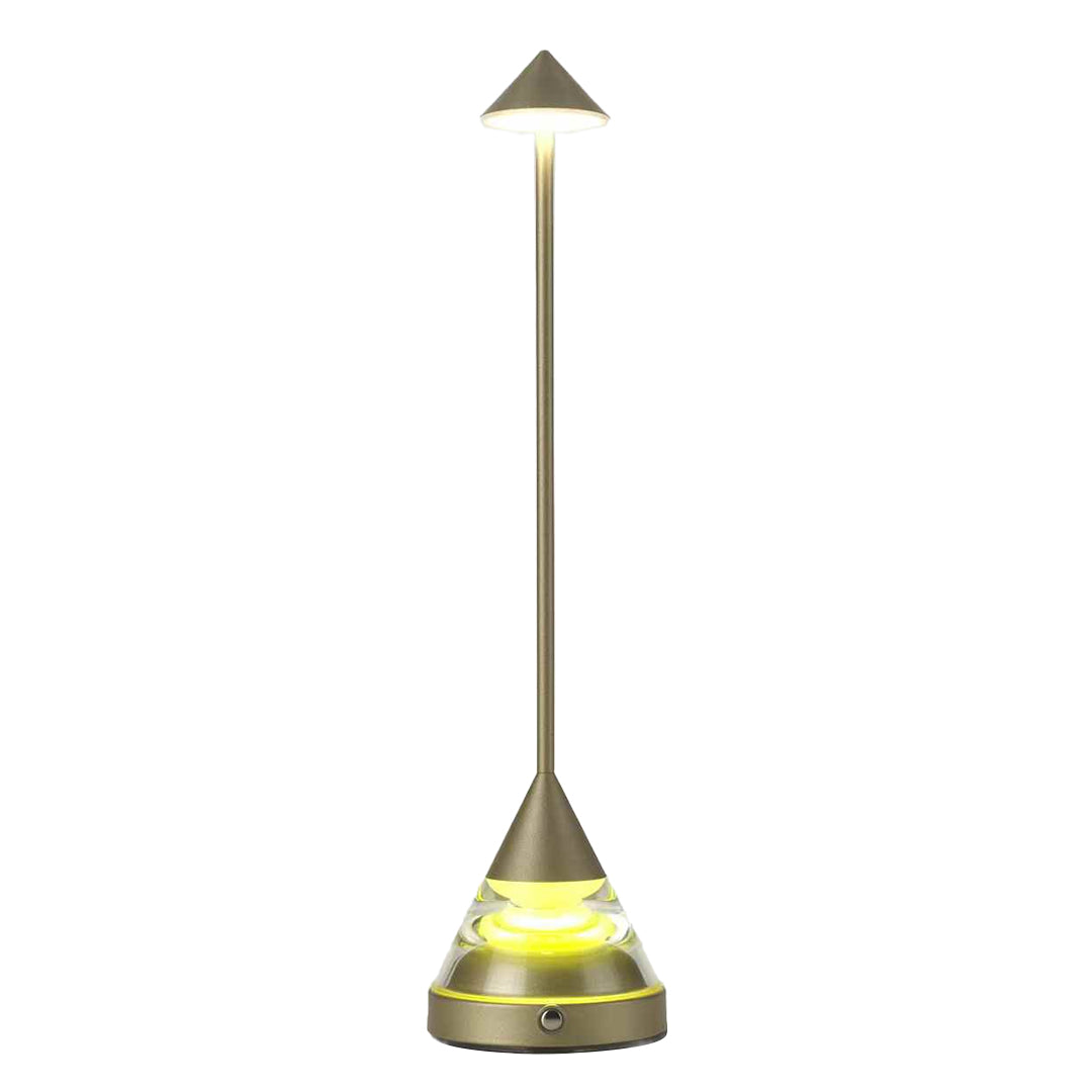 Front view of a champagne gold unique small table lamp casting a soft glow on an isolated white background.