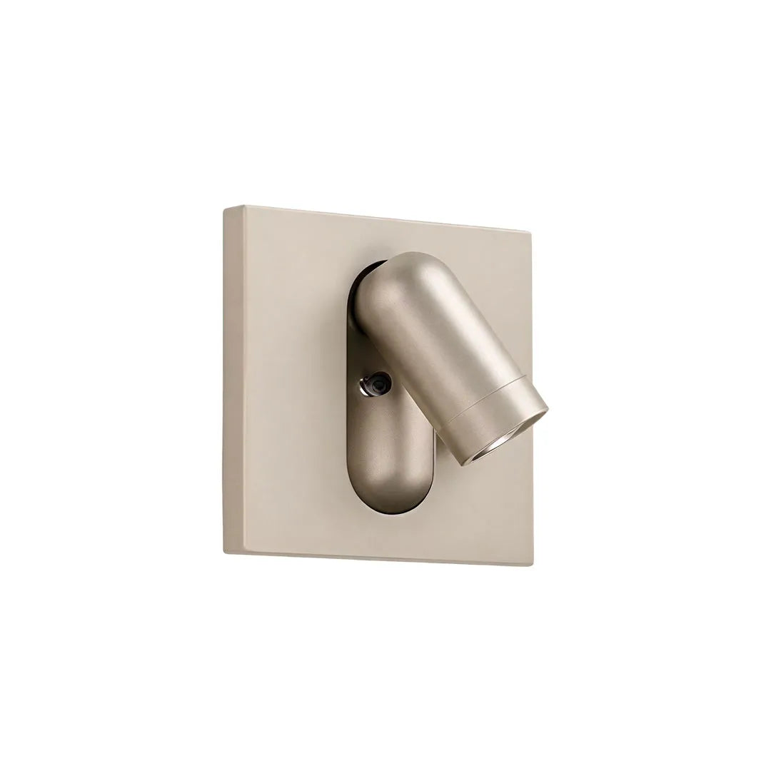 Champagne wall mounted LED reading light with a compact directional spotlight head.