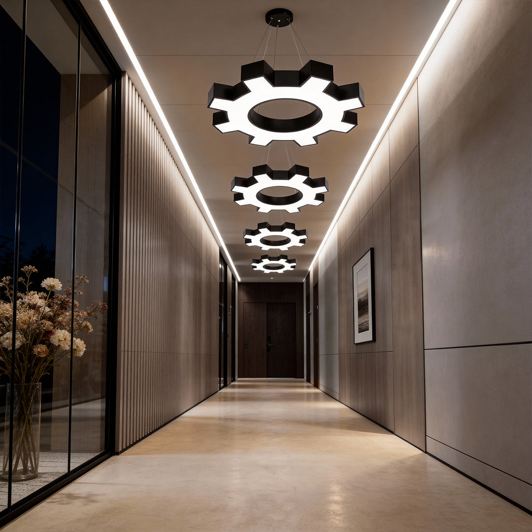 Chandelier black modern casting a focused glow in a chic corridor.