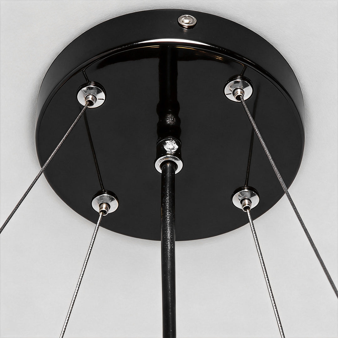 Chandelier black modern illuminating a modern hallway with elegant light.