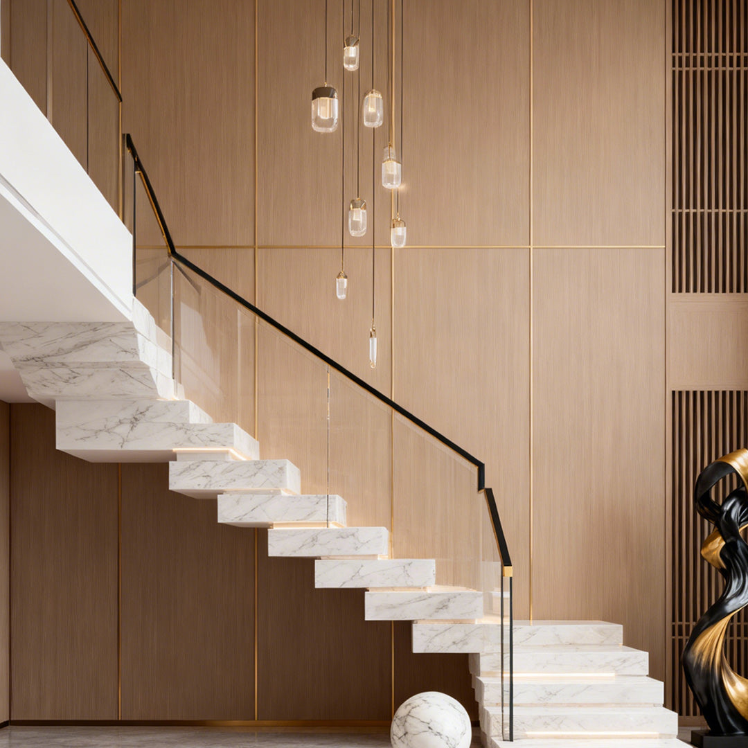 Chandelier for staircase suspended in contemporary space with wood paneling and floating stairs providing sculptural illumination