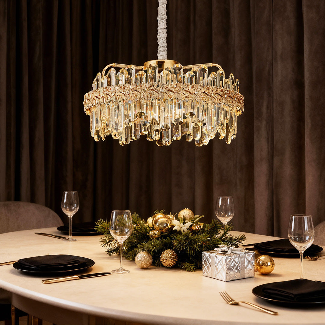 Chandelier lamps crystal over a round dining table with neutral tones.