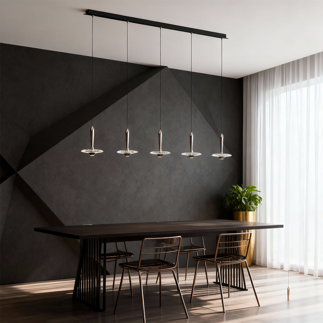 Chandelier with round crystals featuring linear drop design above modern dining table in sophisticated dark interior